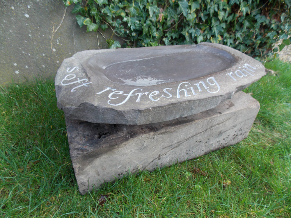 Caitriona Cartwright, a carved stone bird bath cut by hand.