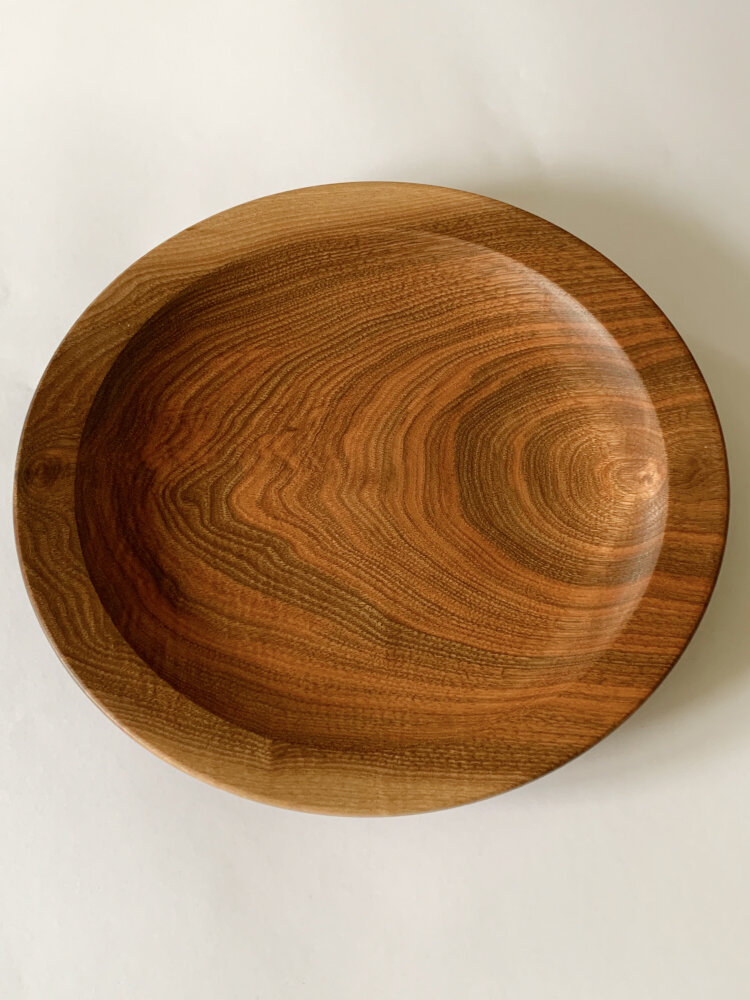 Chris Armstrong, a walnut platter turned to follow the grain.